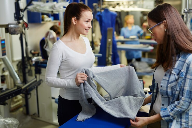 Customer inspecting and satisfied with cleaned clothes